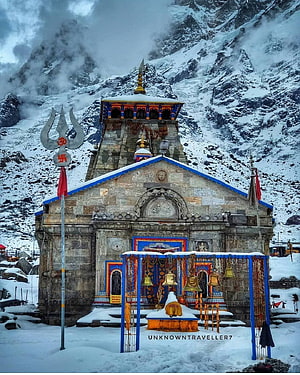 Kedarnath Temple in Snowy Himalayan Mountains with Prayer Bells and Trishul HD phone wallpaper