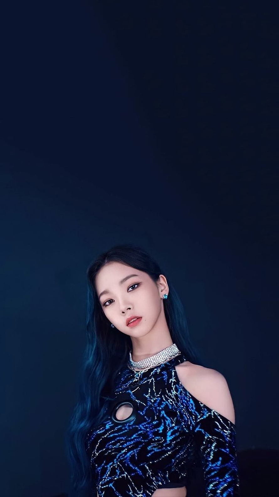 Karina from aespa in a shimmering blue sequined top with a dark studio backdrop HD phone wallpaper