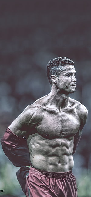 Cristiano Ronaldo shirtless portrait with defined abs and athletic physique in dramatic monochrome style HD phone wallpaper