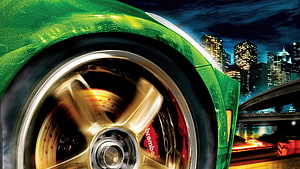 Need For Speed Underground 2 Green Car Wheel Close-Up With City Skyline HD wallpaper