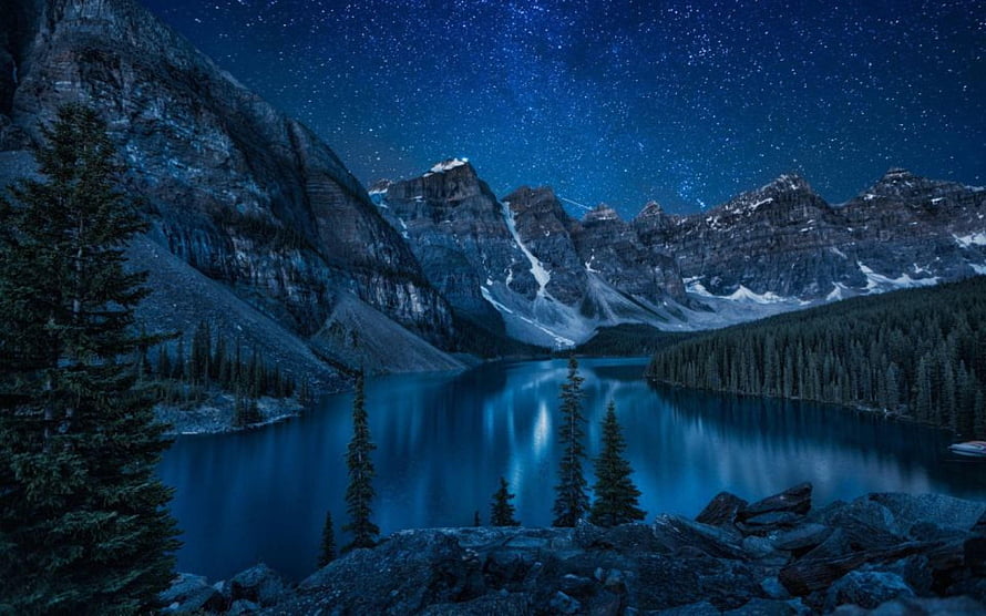 Moraine Lake at Night Under a Starry Sky in Banff National Park, Canada HD wallpaper