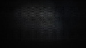 Dark Carbon Fiber Mesh Texture with Subtle Center Glow and Vignette HD wallpaper