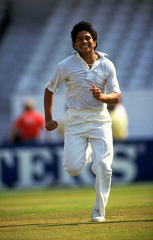 Sachin Tendulkar Celebrating a Wicket in Classic White Cricket Attire on the Field HD phone wallpaper