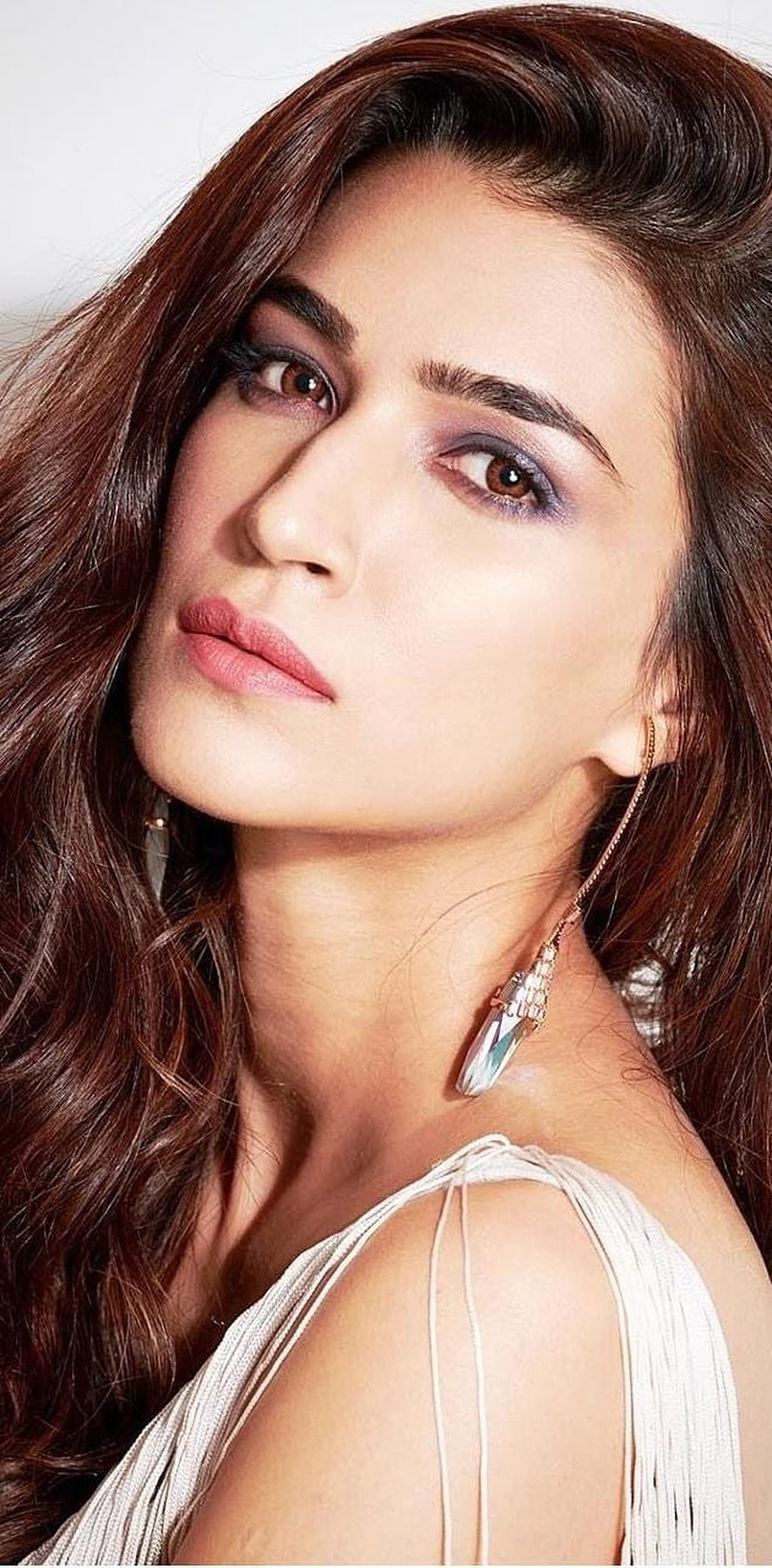 Kriti Sanon Elegant Portrait With Flowing Hair And Statement Earrings HD phone wallpaper