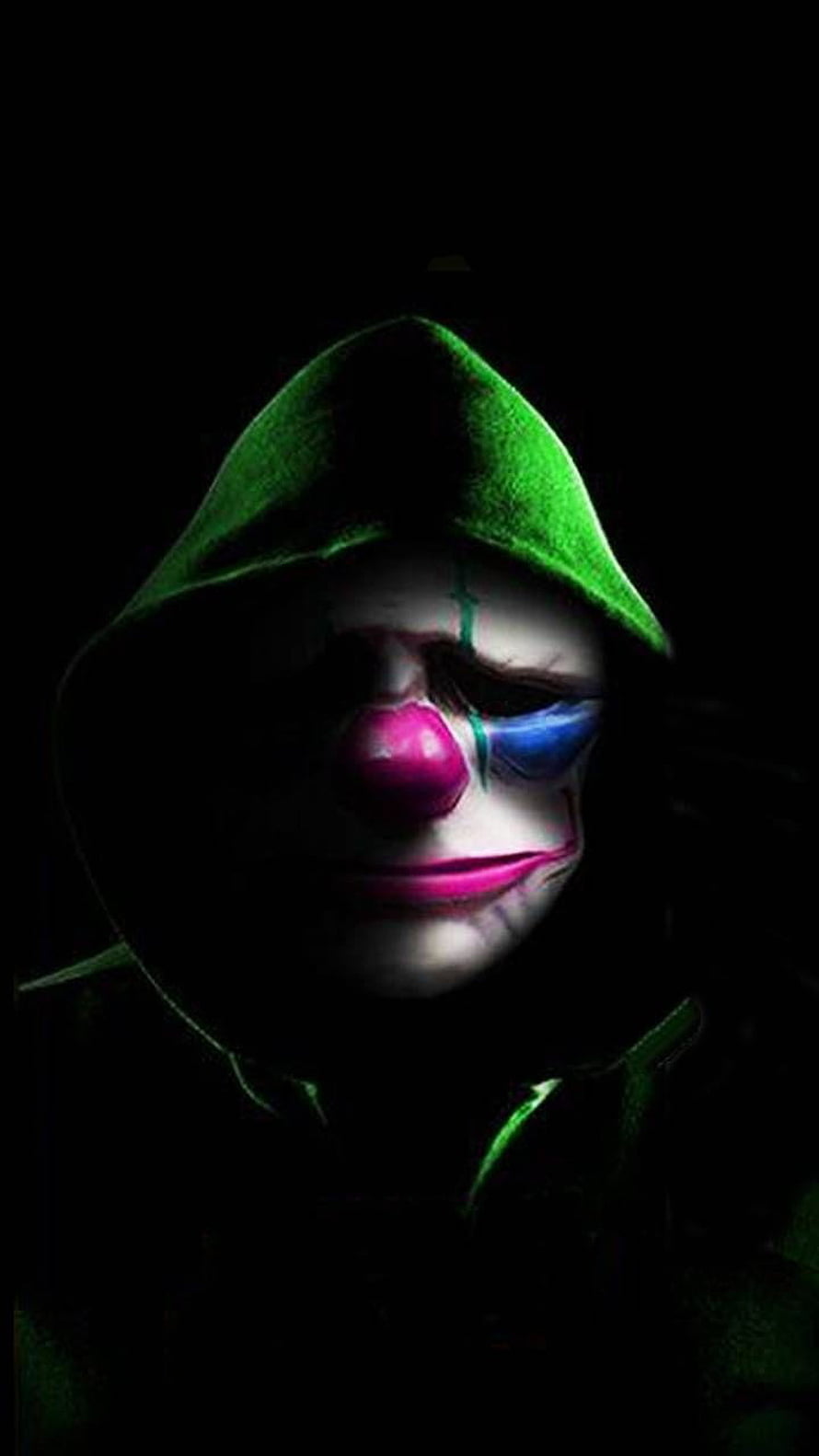 Green Hooded Criminal with Clown Makeup in Dark Portrait HD phone wallpaper
