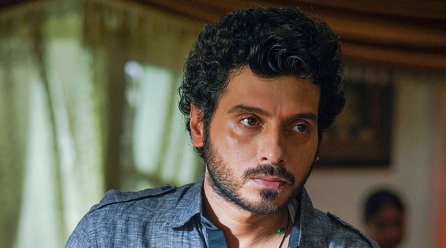 Munna Bhaiya from Mirzapur in a dramatic close-up with intense expression and curly hair HD wallpaper