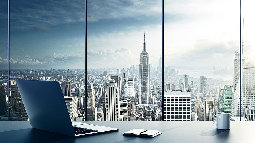 Modern Office Desk with Laptop and Notebook Overlooking New York City Skyline HD wallpaper