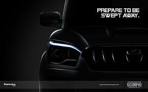 Mahindra Scorpio Front Headlight and Grille Close-Up in Dramatic Black Lighting HD wallpaper