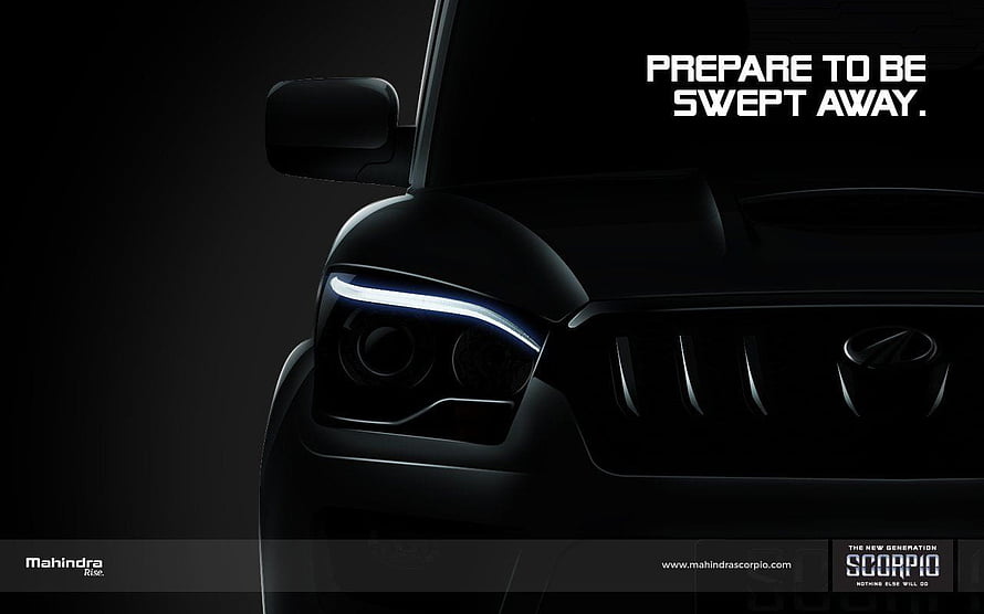 Mahindra Scorpio Front Headlight and Grille Close-Up in Dramatic Black Lighting HD wallpaper