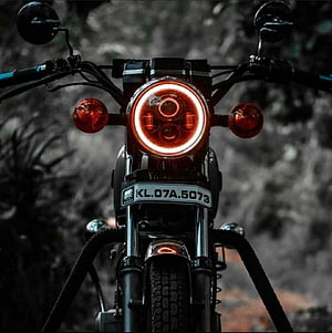 Front View of a Yamaha Motorcycle with Glowing Red Headlight and Turn Signals HD phone wallpaper