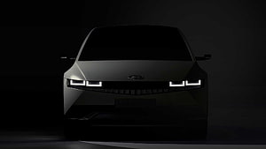 Hyundai Ioniq 5 Electric Vehicle Front View in Dramatic Dark Studio Lighting HD wallpaper