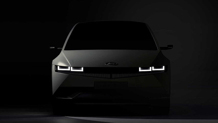 Hyundai Ioniq 5 Electric Vehicle Front View in Dramatic Dark Studio Lighting HD wallpaper