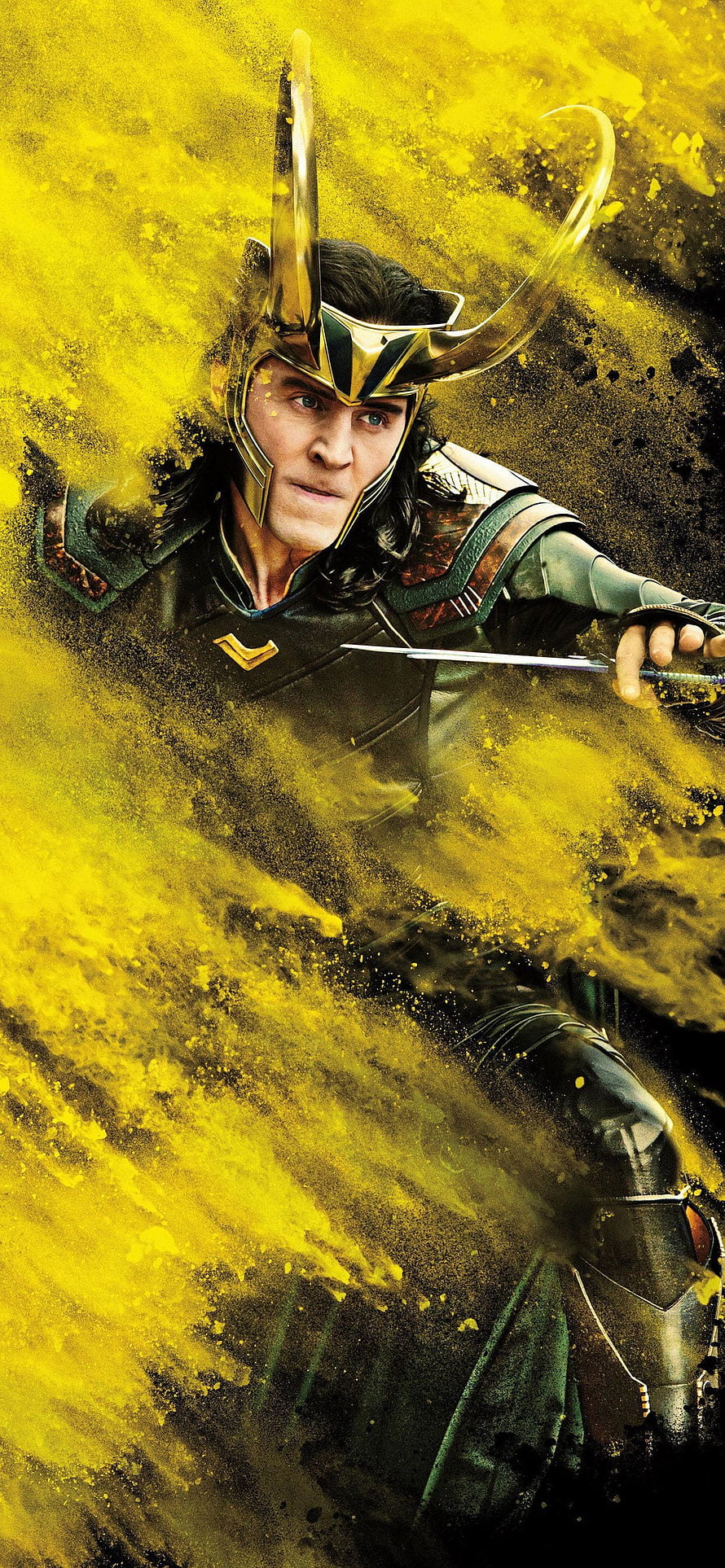 Loki in Golden Horned Helmet Wielding Dagger Amidst Yellow Dust Explosion HD phone wallpaper