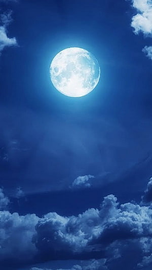 Luminous Full Moon Glowing in Deep Blue Sky with Dramatic Clouds HD phone wallpaper