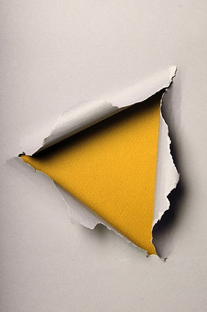 Minimalist Ripped White Paper Revealing Vibrant Yellow Underlayer HD phone wallpaper
