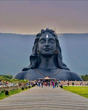Adiyogi Statue at Isha Yoga Center with Visitors on the Approach Path HD phone wallpaper