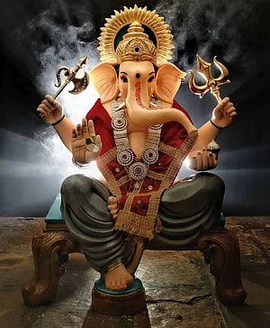 Ganesha seated on ornate throne holding axe and trident with radiant golden halo HD phone wallpaper