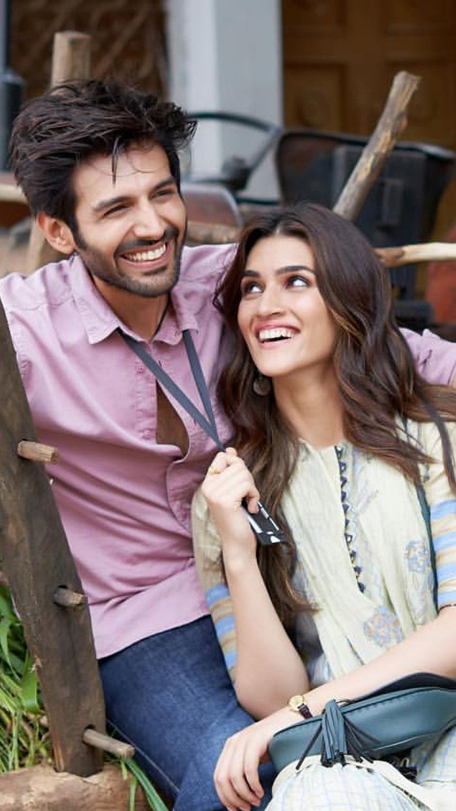 Bollywood Romantic Couple Sharing a Joyful Moment in a Rustic Outdoor Setting HD phone wallpaper