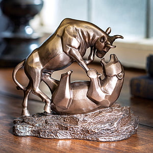 Bronze Bull and Bear Sculpture on Rock Base for Financial Office Decor HD wallpaper