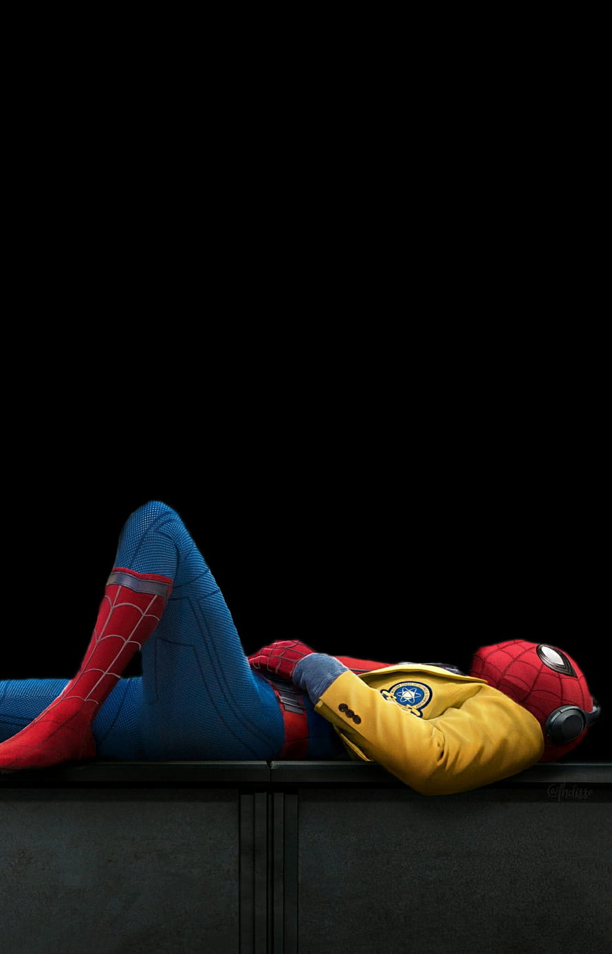 Spider-Man Homecoming Reclining in Yellow Suit on Dark Rooftop HD phone wallpaper