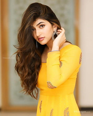 Sree Leela in a vibrant yellow embroidered kurta with long wavy hair and statement earrings HD phone wallpaper