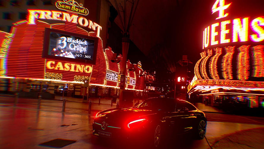 Neon-lit Fremont Casino and 4 Queens at night with a sleek black sports car HD wallpaper