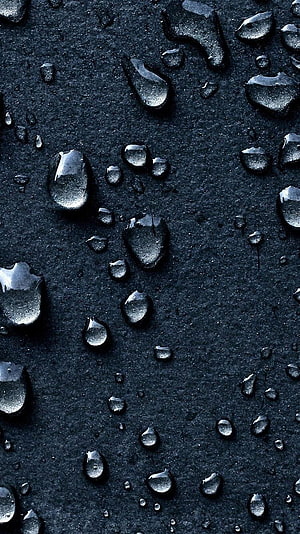 Macro Water Droplets on Dark Textured Surface HD phone wallpaper