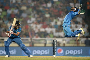 MS Dhoni Diving Catch During Cricket Match HD wallpaper