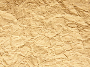 Warm Brown Crumpled Paper Texture with Organic Folds and Rugged Surface Detail HD wallpaper