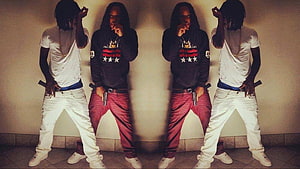 Chief Keef and associates posing with firearms in a symmetrical street style composition HD wallpaper