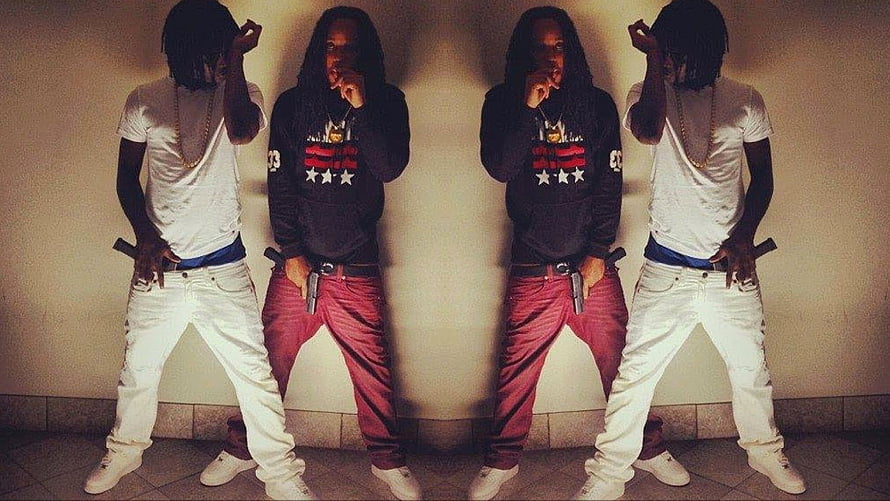 Chief Keef and associates posing with firearms in a symmetrical street style composition HD wallpaper