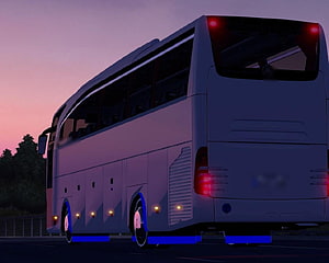 White Coach Bus with Blue Underglow Lighting on a Road at Dusk HD wallpaper