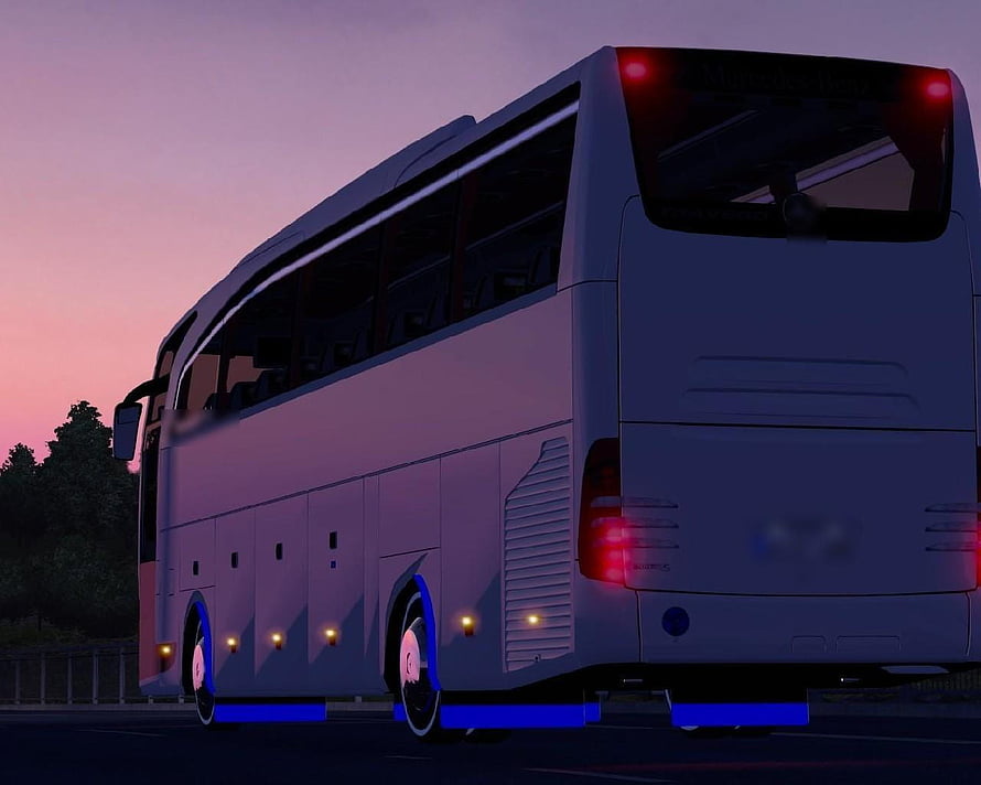 White Coach Bus with Blue Underglow Lighting on a Road at Dusk HD wallpaper