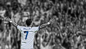 Cristiano Ronaldo celebrating with arms raised in white jersey before a stadium crowd HD wallpaper
