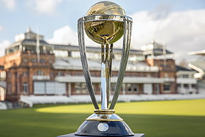 ICC Cricket World Cup Trophy on a Cricket Ground with Stadium in Background HD wallpaper