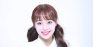 Chuu from Loona in a white collared shirt with auburn pigtails and a bright smile HD wallpaper