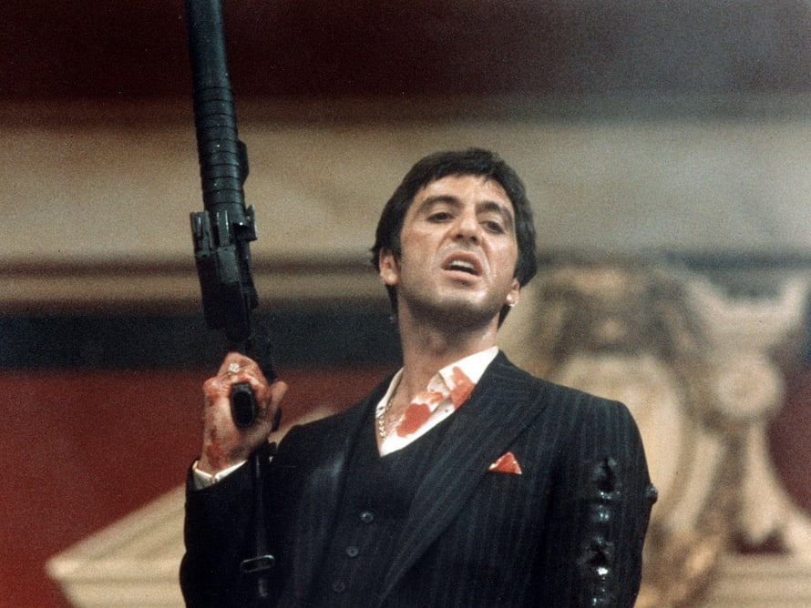 Tony Montana in Scarface Holding a Shotgun in a Pinstripe Suit HD wallpaper