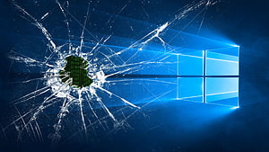 Windows 10 Logo on a Shattered Glass Screen with Digital Matrix Code HD wallpaper