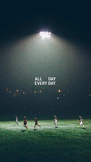 Night Football Training Session Under Stadium Floodlights with Motivational Quote HD phone wallpaper