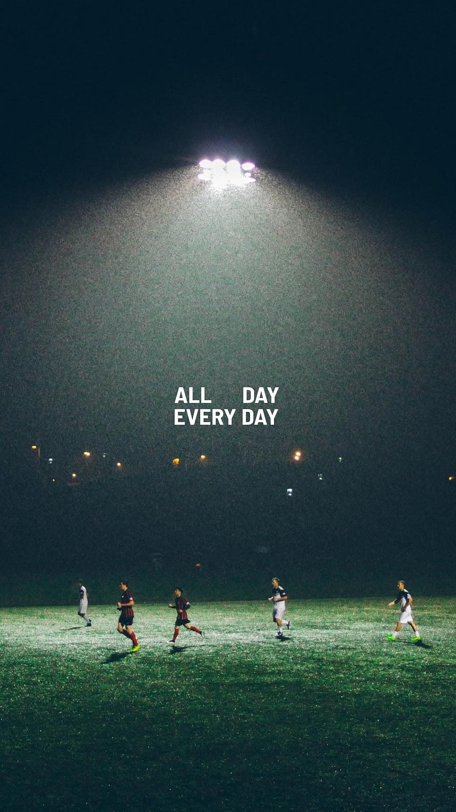 Night Football Training Session Under Stadium Floodlights with Motivational Quote HD phone wallpaper