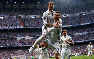 Cristiano Ronaldo and Sergio Ramos celebrate a goal in Real Madrid white kits at the Bernabéu HD wallpaper