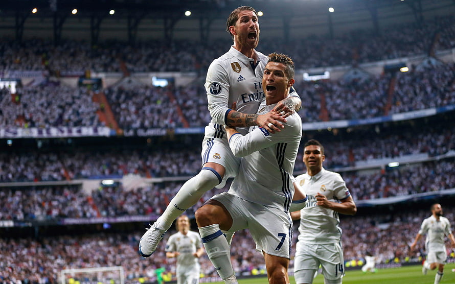 Cristiano Ronaldo and Sergio Ramos celebrate a goal in Real Madrid white kits at the Bernabéu HD wallpaper