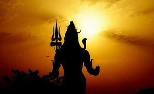 Lord Shiva Silhouette Holding Trishula Against Golden Sunset Sky HD wallpaper