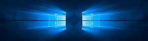 Windows 10 Dual Monitor Setup With Glowing Blue Window Logos On Dark Wall HD wallpaper