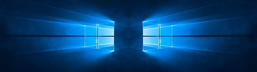 Windows 10 Dual Monitor Setup With Glowing Blue Window Logos On Dark Wall HD wallpaper