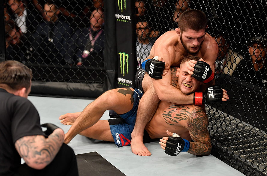 Khabib Nurmagomedov and Dustin Poirier in UFC Octagon Grappling Action HD wallpaper