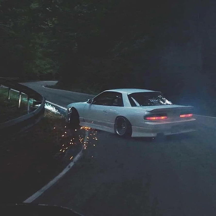 White JDM Drift Car Sliding on a Dark Mountain Road at Night with Sparks HD phone wallpaper