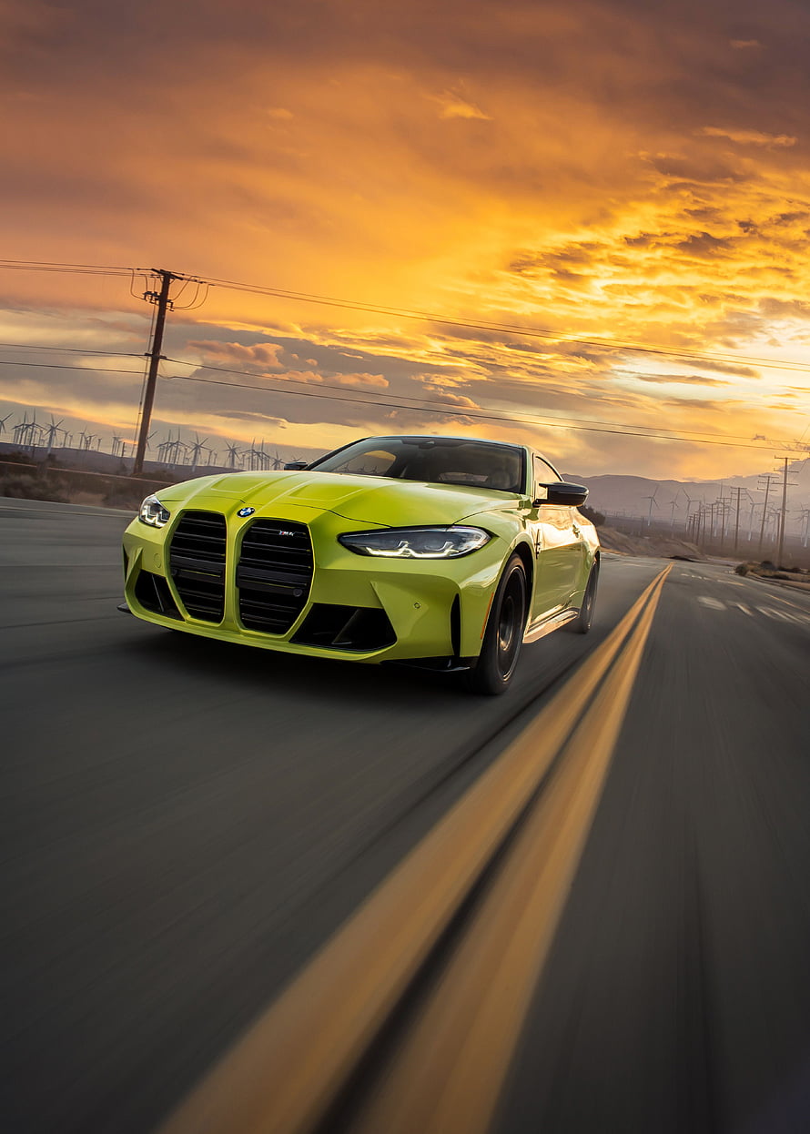 Lime Green BMW M4 Coupe Driving on Desert Highway at Golden Sunset HD phone wallpaper