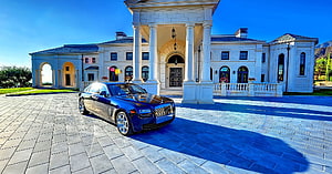 Luxury Blue Rolls-Royce Ghost Parked Before Grand White Estate Mansion HD wallpaper