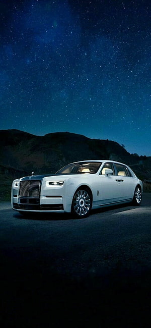 White Rolls Royce Ghost Luxury Sedan Parked Under a Starry Night Sky HD phone wallpaper